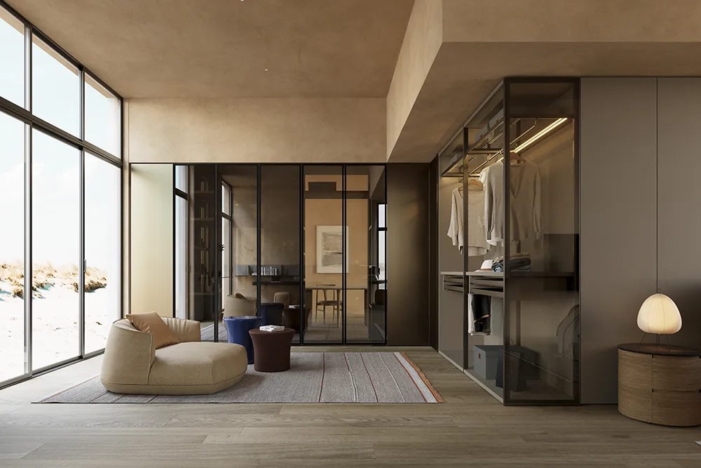 Suite con zona relax, poltrona sacco, cabina armadio a vista con anta in vetro e comodino in legno con lampada scultorea